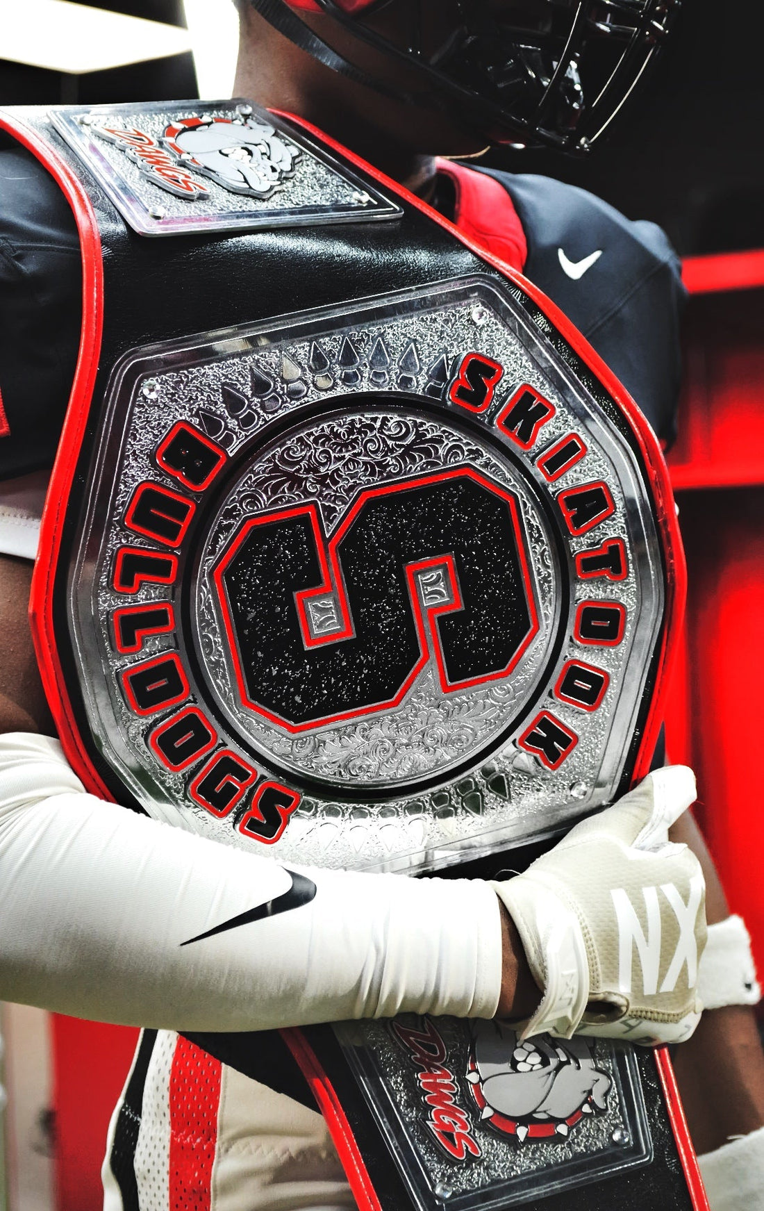 Custom football championship belt with oversized center plate and red strap by ProAmBelts