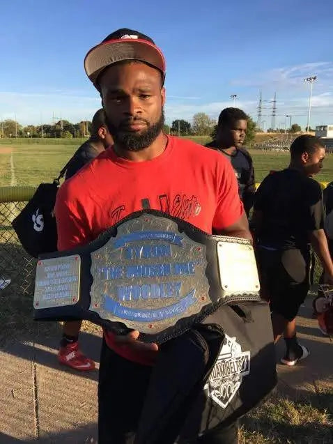 UFC Champion Tyron Woodley receives a custom championship belt by ProAmBelts