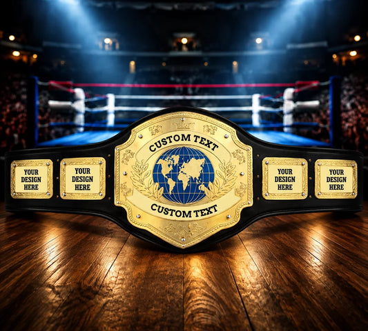 A custom championship-style belt with a large gold central plate featuring a blue globe emblem and four smaller gold side plates, displayed on a wooden surface with a blurred boxing ring arena in the background.