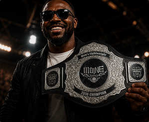 Winner holding championship belt