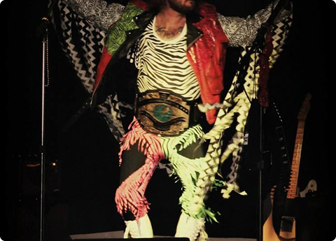 Musician wearing championship belt