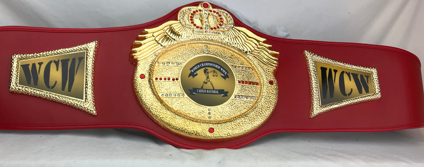 A red and gold WCW wrestling championship belt 